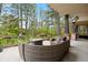 Covered patio with comfortable seating, a fireplace, and views of the surrounding landscape at 315 Prospect Dr, Castle Rock, CO 80108