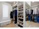Walk-in closet with built-in shelving and mirror, providing ample storage space for clothing and shoes at 315 Prospect Dr, Castle Rock, CO 80108