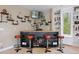 Home wet bar with a custom wood bar and open shelving for displaying decorative liquor bottles at 315 Prospect Dr, Castle Rock, CO 80108
