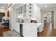 Elegant wet bar with glass cabinets, wine cooler, and sink at 315 Prospect Dr, Castle Rock, CO 80108