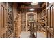 Custom wine cellar featuring brick walls, wooden shelving, and ample storage for wine collections at 315 Prospect Dr, Castle Rock, CO 80108