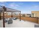 Spacious rooftop deck featuring a pergola-covered seating area, perfect for entertaining at 8331 Farmers Way, Highlands Ranch, CO 80129