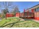 Backyard features a well-kept lawn, a shed, and a deck for outdoor enjoyment at 10978 W Ada Pl, Lakewood, CO 80226