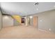 Expansive basement space with neutral carpet, ready to be customized for your needs at 10978 W Ada Pl, Lakewood, CO 80226