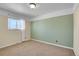 Clean bedroom with neutral carpet, one window with lots of natural light, and fresh paint at 10978 W Ada Pl, Lakewood, CO 80226