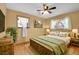 Inviting bedroom with natural wood accents, lots of light, and a cozy atmosphere at 10978 W Ada Pl, Lakewood, CO 80226