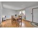 Bright dining room with hardwood floors, natural light, and a cozy atmosphere at 10978 W Ada Pl, Lakewood, CO 80226