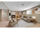 Cozy living room features a fireplace, built-in shelving, and comfortable seating at 10978 W Ada Pl, Lakewood, CO 80226