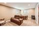 Finished basement with a comfortable seating area and a game table at 5190 S Emporia Way, Greenwood Village, CO 80111