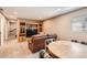 Basement with comfortable seating, entertainment center, and a round table for gathering and leisure at 5190 S Emporia Way, Greenwood Village, CO 80111