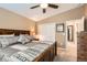 Bedroom featuring a wooden bed frame, closet doors, a ceiling fan, and neutral decor for a relaxing atmosphere at 5190 S Emporia Way, Greenwood Village, CO 80111
