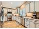 Charming kitchen with granite countertops, stainless steel appliances, and beautiful cabinetry at 5190 S Emporia Way, Greenwood Village, CO 80111