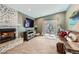 Living room featuring a fireplace, sliding glass doors, and plush seating at 5190 S Emporia Way, Greenwood Village, CO 80111