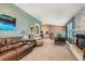 Open-concept living room featuring a fireplace and access to the dining area at 5190 S Emporia Way, Greenwood Village, CO 80111