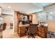 The well-equipped home office space includes a wooden desk, storage, and natural lighting for a productive work environment at 5190 S Emporia Way, Greenwood Village, CO 80111