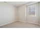 Well-lit bedroom featuring neutral walls, plush carpet, and a window at 18318 E 93Rd Pl, Commerce City, CO 80022