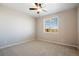 Bright bedroom featuring neutral walls, plush carpet, and a window at 18318 E 93Rd Pl, Commerce City, CO 80022