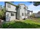 Well-maintained backyard showcasing green grass, landscaping, and privacy fencing at 10519 Winterflower Way, Parker, CO 80134