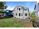 Spacious backyard with a deck, plenty of grass for activities, and partial fencing at 10519 Winterflower Way, Parker, CO 80134