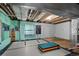 Finished basement with exercise equipment and mirrored wall; ready for your creative ideas at 10519 Winterflower Way, Parker, CO 80134