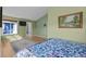 Bright bedroom with views, wood floors, and serene light green walls at 10519 Winterflower Way, Parker, CO 80134