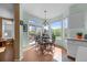 A bright and airy dining area with large windows offering scenic views at 10519 Winterflower Way, Parker, CO 80134