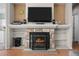 Cozy living room features a stone fireplace with hearth and mantel at 10519 Winterflower Way, Parker, CO 80134