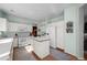 A bright, open kitchen featuring an island and stainless steel appliances at 10519 Winterflower Way, Parker, CO 80134