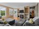 Cozy living room featuring a stone fireplace and comfortable seating at 10519 Winterflower Way, Parker, CO 80134