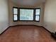 Bright living room featuring a large bay window and neutral colored walls at 10519 Winterflower Way, Parker, CO 80134