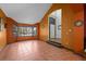 Bright living room featuring terracotta tile floors, an arched entrance and large window at 10519 Winterflower Way, Parker, CO 80134