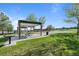 Shaded picnic area with tables and grills offers a place to relax and enjoy outdoor meals within the community at 10519 Winterflower Way, Parker, CO 80134