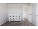 Neutral-toned bedroom with carpet and dresser, showing a hallway to another room at 1301 Sidewinder Cir, Castle Rock, CO 80108