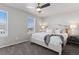 Cozy bedroom with a queen-sized bed, soft carpet, and two windows at 1301 Sidewinder Cir, Castle Rock, CO 80108