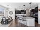 Open concept kitchen with dark cabinetry, granite countertops, a kitchen island and stainless steel appliances at 1301 Sidewinder Cir, Castle Rock, CO 80108