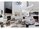 Spacious living room with fireplace, vaulted ceilings, open floor plan, and backyard views at 1301 Sidewinder Cir, Castle Rock, CO 80108