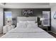Well-lit main bedroom with a stylish grey accent wall and rustic decor at 1301 Sidewinder Cir, Castle Rock, CO 80108