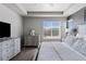 Bright main bedroom with a large window, trey ceiling, and neutral color palette at 1301 Sidewinder Cir, Castle Rock, CO 80108