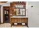 Bathroom featuring a double sink vanity and a walk-in closet at 4398 Cameyo Rd, Indian Hills, CO 80454