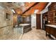 Luxurious bathroom featuring a glass shower, soaking tub, and wood accents at 4398 Cameyo Rd, Indian Hills, CO 80454