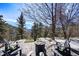 Cozy outdoor fire pit area with comfortable seating and mountain views at 4398 Cameyo Rd, Indian Hills, CO 80454