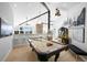 Spacious game room features a pool table, wet bar, and ample lighting, ideal for entertainment and leisure at 4398 Cameyo Rd, Indian Hills, CO 80454
