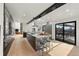 Open kitchen with stainless steel appliances, a center island with seating, and outdoor access at 4398 Cameyo Rd, Indian Hills, CO 80454
