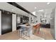 Bright kitchen featuring stainless steel appliances, gray cabinets, and seating at the island at 4398 Cameyo Rd, Indian Hills, CO 80454