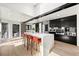 Kitchen with white countertops, modern cabinets, and seating at the island at 4398 Cameyo Rd, Indian Hills, CO 80454