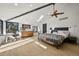 Main bedroom features wood floors, a ceiling fan, and a window view at 4398 Cameyo Rd, Indian Hills, CO 80454