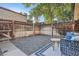 A private backyard featuring a small patio area and gravel landscaping at 5511 S Lowell Blvd, Littleton, CO 80123