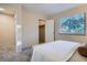 Bright bedroom featuring an open closet and a large window with blinds at 5511 S Lowell Blvd, Littleton, CO 80123