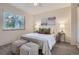 Comfortable bedroom featuring carpet, a large window with blinds and ceiling fan at 5511 S Lowell Blvd, Littleton, CO 80123