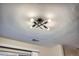 Close-up of a unique ceiling light fixture featuring a modern, industrial design at 5511 S Lowell Blvd, Littleton, CO 80123